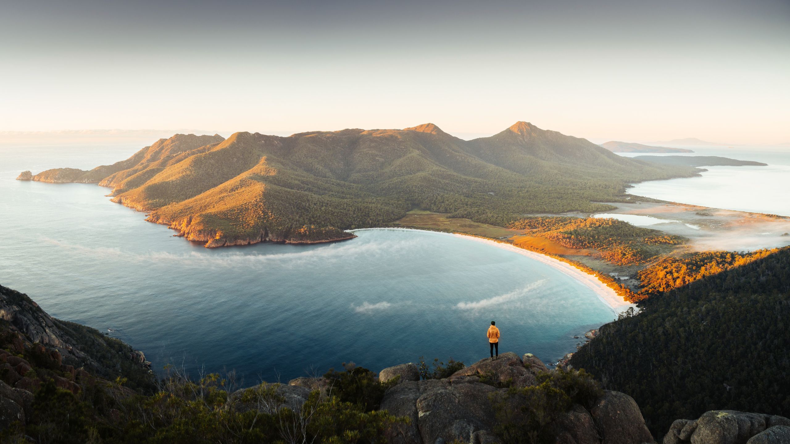 Hiker Overlooking Wineglass Bay With Panoramic Views