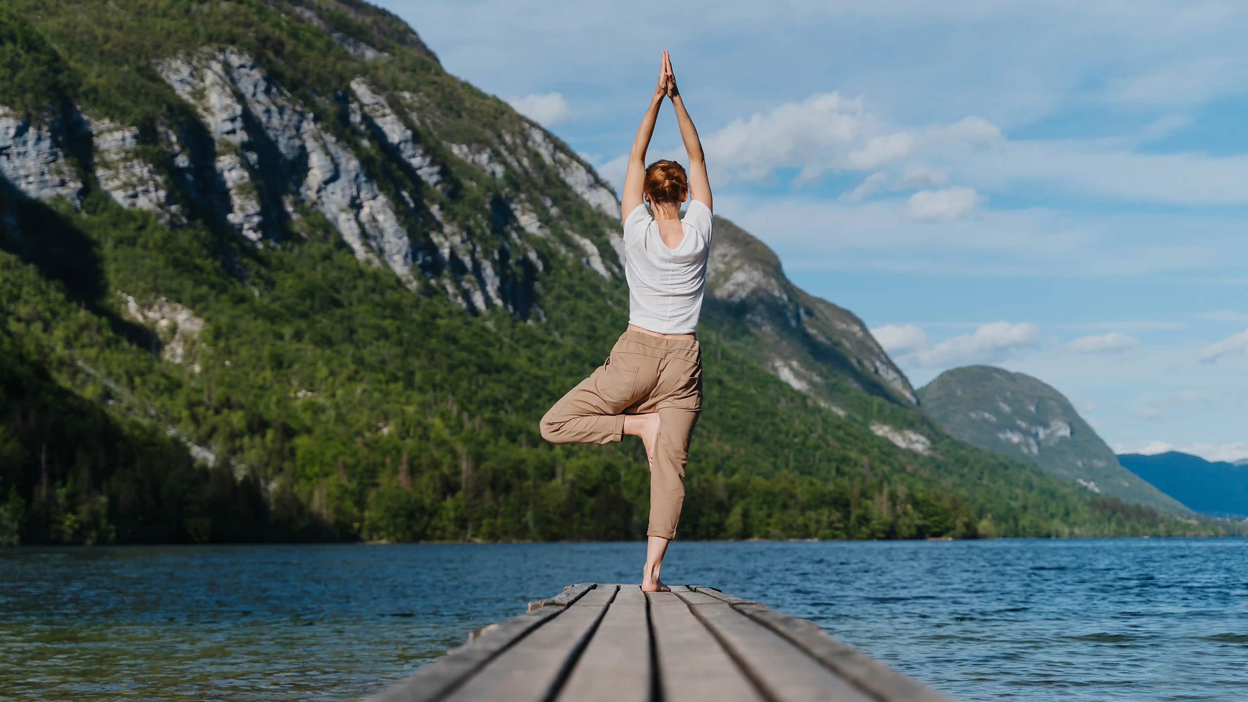 mountain-lake-yoga-shutterstock_2618197549