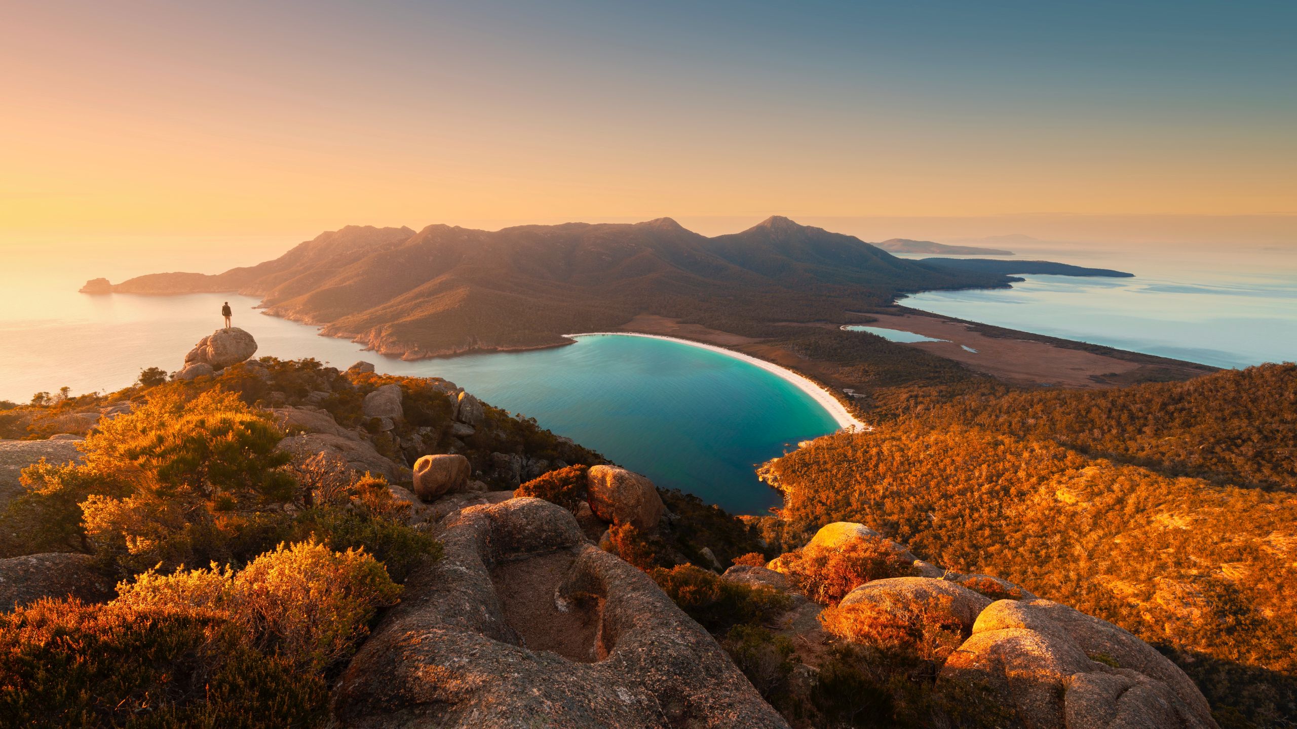 Hiker on top at Wineglass Bay Walk Sunset