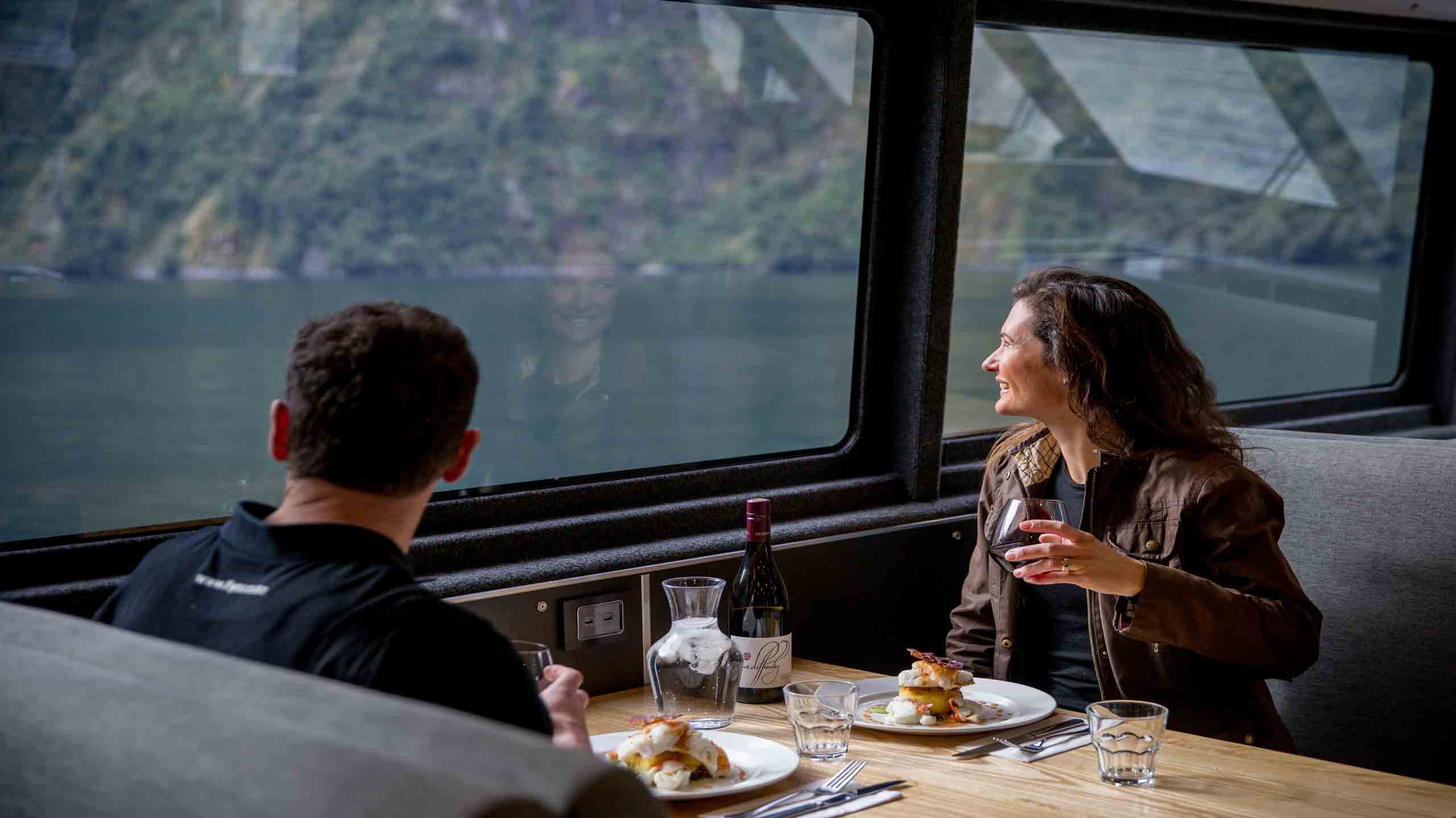 Fiordland-jewel-milford-sounds-new-zealand-dining-looking-out-window