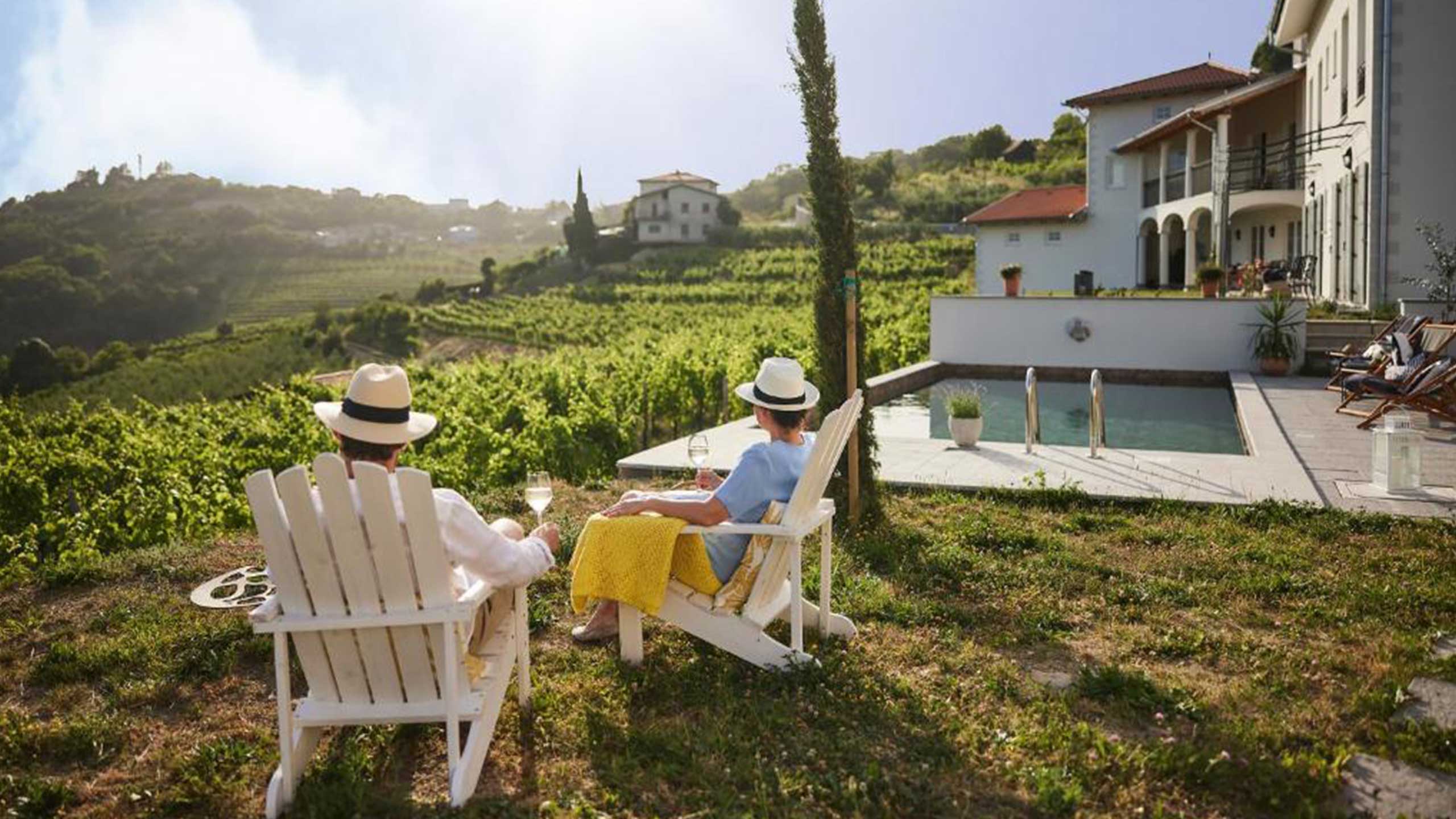couple-relax-pool-peterc-vineyard-estate-kojsko-goriska-brda-slovenia