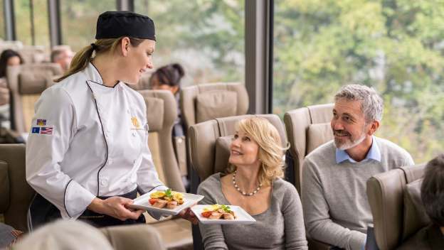 rocky-mountaineer-rail-journey-silverleaf-service-chef-serving-lunch-united-states-america-southwest-rockies-to-red-rocks