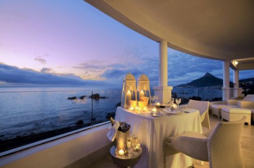 twelve-apostles-hotel-and-spa-cape-town-south-africa-dining-balcony-dusk