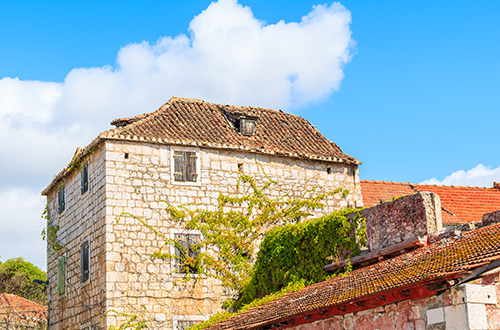 old-house-milna-town-brac-croatia-shutterstock716372878