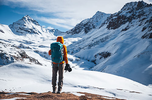 woman-photographer-on-high-altitude-mountain-top
