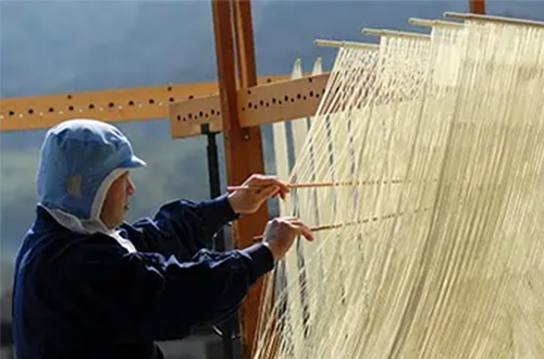 woman-making-somen-noodles-shodoshima-japan