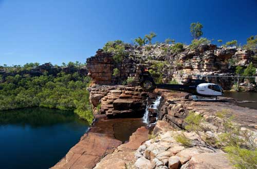 kimberley-snapshot-cruise-true-north-helicopter-on-waterfall