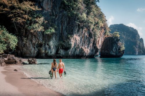 kao-lao-six-senses-yao-noi-thailand-snorkel-couple-walking-private-beach